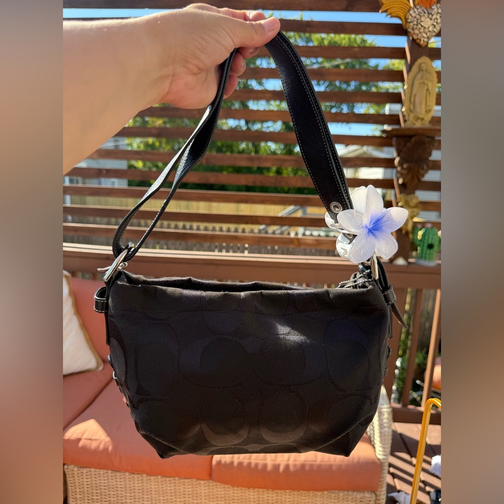 Coach Demi hobo 90’s slouchy bag 
With iconic C monogram print .